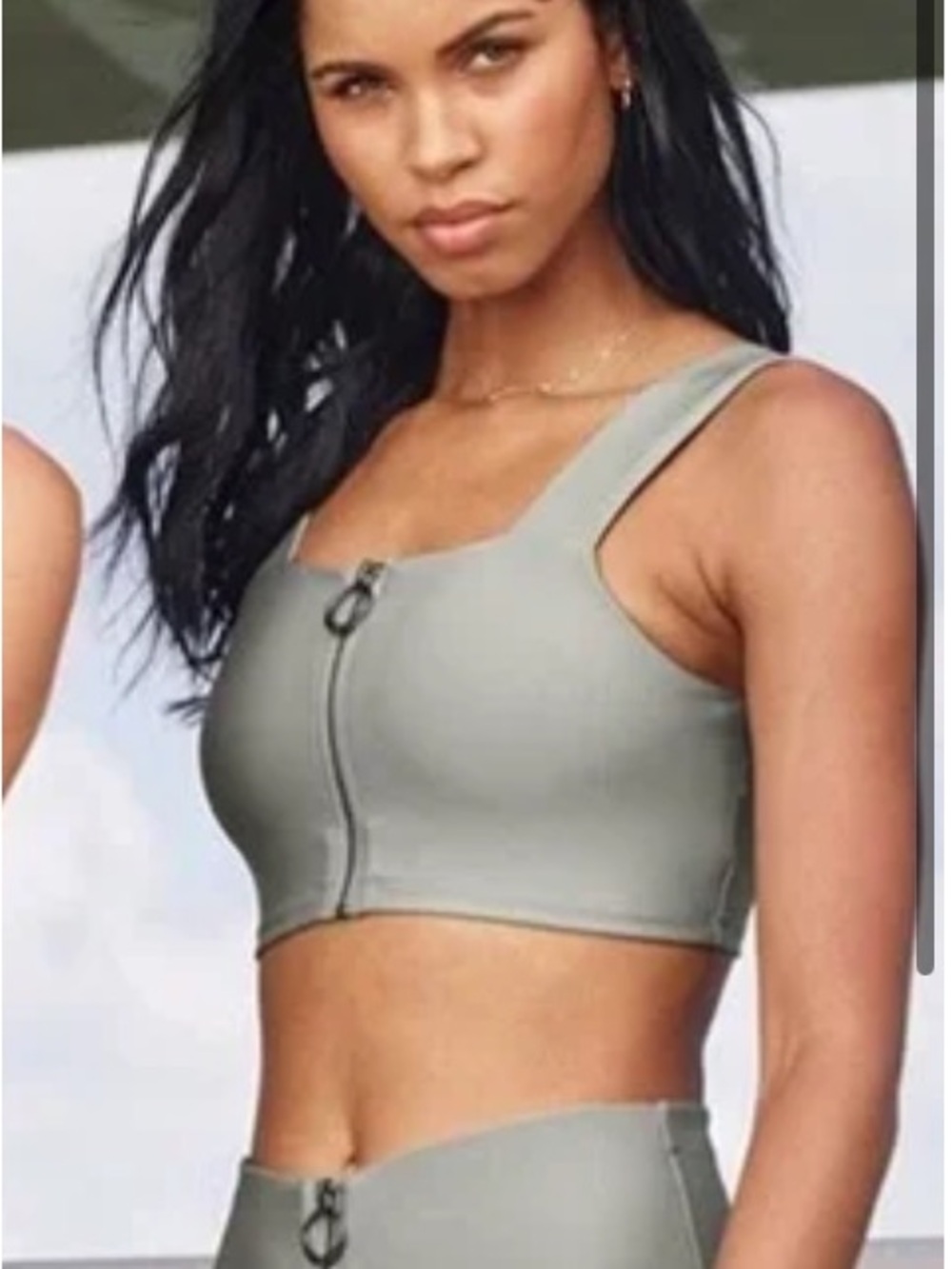 Stylish Alo Front Fast Zip Bra top Size Medium in gray silver color